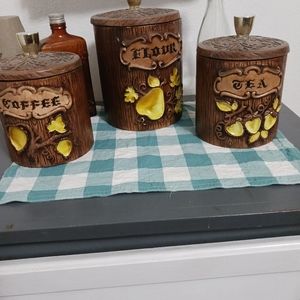 Vintage Treasure Craft woodgrain flour,tea, and coffee canisters.